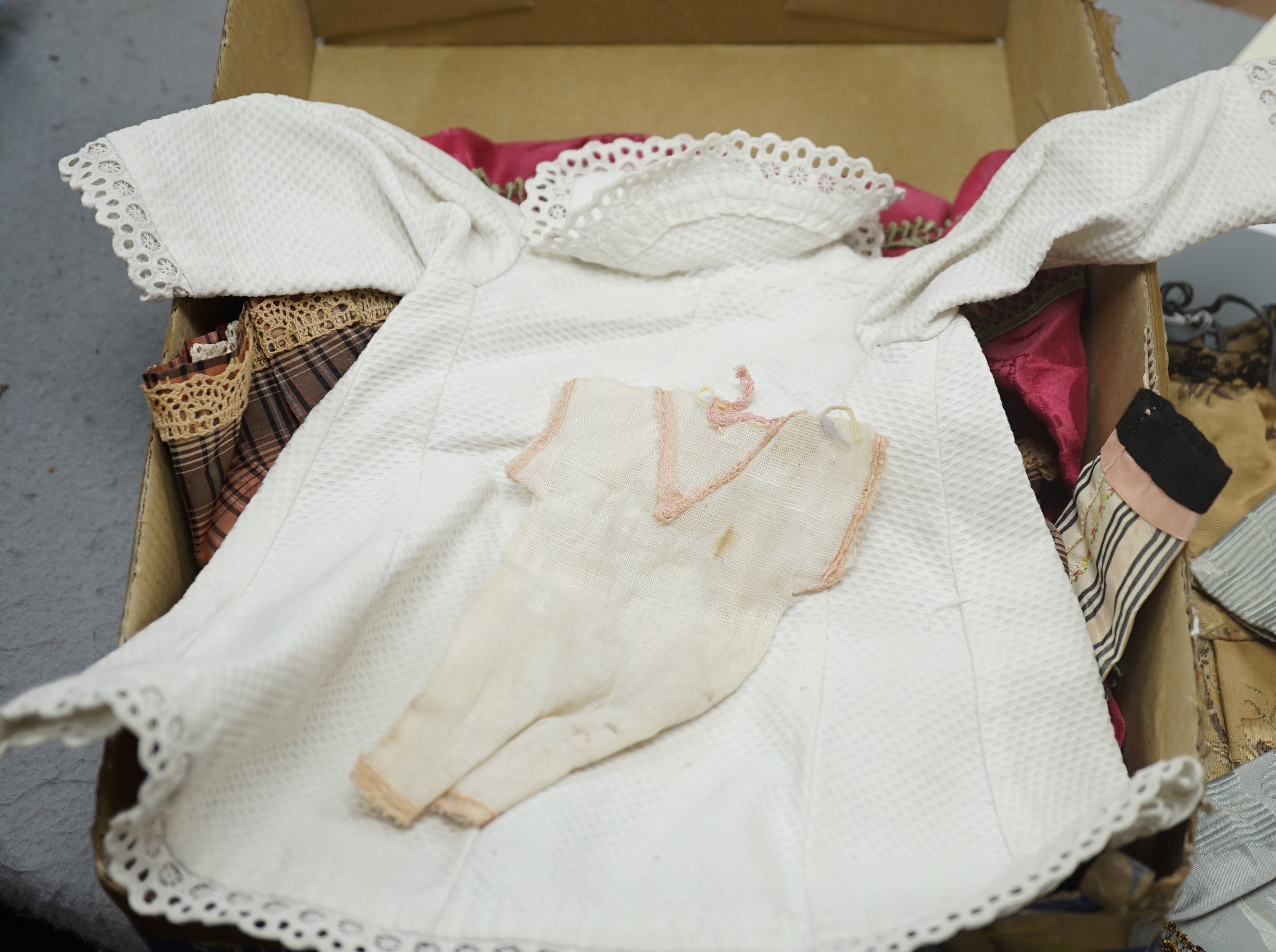 Eight dolls dresses and one hat, average 26cm